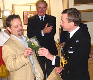 Tony Groom receives fragment of unexploded bomb he helped remove from HMS Argonaut  