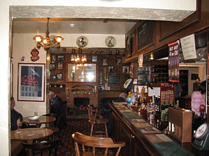 The long bar of The Woodmancote Arms