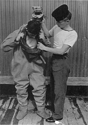 'P' Party trainee being dressed in Shallow Water Diving Suit
