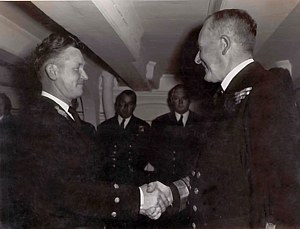 Ginger Bryant being presented with his BEM on board HMS Victory