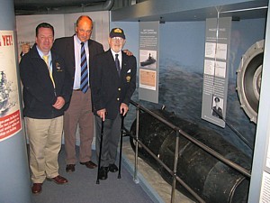 Brad King, David Ouvry and Noel Cashford with John Ouvry's mine on board HMS Belfast