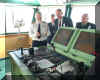 Commodore Warwick explains the ship's manoeuvring system console.jpg (128058 bytes)