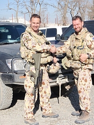 Lt Cdr Doug Griffiths RAN (left) and Lt Cdr David Ince RAN handing over in Kabul