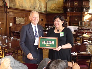 Brian Dutton presents display case of medals to Leona Roberts 