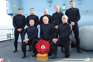 Chiddingfold's Diving Team with the wreath and Ginger’s ashes on the foc’sle