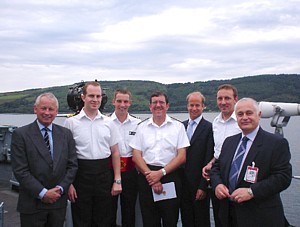 Commodore Hudson flanked by other former COs of HMS Cottesmore including MCDOA members David Hilton (far left) and Chris Thompson (far right) the evening before her joint-decommissioning ceremony with Brecon and Dulverton at Faslane on 14 July 2005