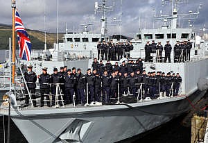 Returned crews gathered on the deck of HMS Walney