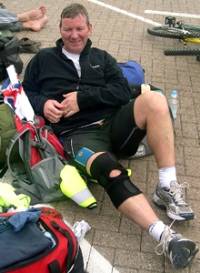  Ian Fleming recovering after his 65-mile run – which left his feet heavily blistered.